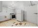 Small basement kitchenette with stove and fridge at 3230 S Bannock St, Englewood, CO 80110