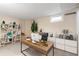 Basement office with desk, shelving and plants at 3230 S Bannock St, Englewood, CO 80110