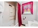 A clean bathroom with a tub, shower, and window at 3230 S Bannock St, Englewood, CO 80110