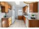 View of a kitchen with wood cabinets and appliances at 3230 S Bannock St, Englewood, CO 80110