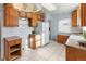 Bright kitchen with wood cabinets and tiled floor at 3230 S Bannock St, Englewood, CO 80110