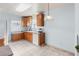 Kitchen with oak cabinets and a tile floor at 3230 S Bannock St, Englewood, CO 80110