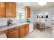 Kitchen with light wood cabinets and tile floor at 3230 S Bannock St, Englewood, CO 80110