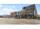 Modern street view featuring various shops and businesses at 3230 S Bannock St, Englewood, CO 80110