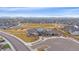 Community clubhouse and park in a residential neighborhood, featuring playgrounds, open space, and mountain views at 6335 E 143Rd Dr, Thornton, CO 80602