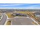 Community clubhouse with a modern architectural design, ample parking, and a beautifully landscaped exterior with mountain views at 6335 E 143Rd Dr, Thornton, CO 80602