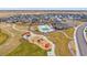 Overhead shot of a community park with a pool, splash pad, playgrounds, seating and green spaces in the community at 6335 E 143Rd Dr, Thornton, CO 80602