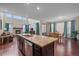 Bright, open kitchen with stainless steel appliances, granite countertops, and an eat-in dining area at 6335 E 143Rd Dr, Thornton, CO 80602