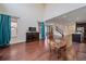 Spacious living room with hardwood floors, high ceilings, and a staircase leading to the second floor at 6335 E 143Rd Dr, Thornton, CO 80602