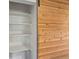 Organized closet with white shelving and a wooden sliding door adds functional storage space at 1580 Youngfield St, Lakewood, CO 80215