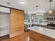 Spacious kitchen featuring updated cabinets, stainless steel appliances, and a large island at 1580 Youngfield St, Lakewood, CO 80215