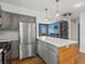 Contemporary kitchen with stainless appliances, gray cabinetry, and spacious island at 1580 Youngfield St, Lakewood, CO 80215