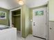 Laundry room with a washer, closet, and white door offers convenience and functionality at 1580 Youngfield St, Lakewood, CO 80215