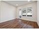 Bedroom with hardwood floors, and natural light from windows and door at 485 Interlocken Blvd # 103, Broomfield, CO 80021