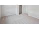 Bright bedroom with plush carpeting and a hallway leading to other rooms at 485 Interlocken Blvd # 103, Broomfield, CO 80021