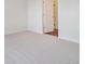Bedroom featuring neutral carpeting and adjacent doorway at 485 Interlocken Blvd # 103, Broomfield, CO 80021