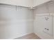 Walk-in closet with neutral carpet, white walls, and metal clothes rods at 485 Interlocken Blvd # 103, Broomfield, CO 80021