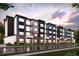 Modern apartment building with brick and siding exterior at 485 Interlocken Blvd # 103, Broomfield, CO 80021