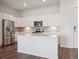 Modern kitchen featuring stainless steel appliances, and white cabinets at 485 Interlocken Blvd # 103, Broomfield, CO 80021