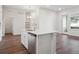 Kitchen with stainless steel dishwasher and sink island at 485 Interlocken Blvd # 103, Broomfield, CO 80021