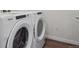 Modern washer and dryer set in laundry area at 485 Interlocken Blvd # 103, Broomfield, CO 80021