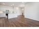 Spacious living room view of kitchen, laundry, and entry doors at 485 Interlocken Blvd # 103, Broomfield, CO 80021