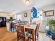 Small dining area with wooden table and chairs at 4982 W Kentucky Ave, Denver, CO 80219