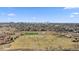 Aerial shot showcases a park with a soccer field and a stunning skyline backdrop at 9925 Keenan St, Highlands Ranch, CO 80130