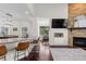 Beautiful kitchen with granite countertops, modern appliances, and seamless flow to the living area at 9925 Keenan St, Highlands Ranch, CO 80130