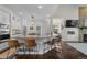 Spacious kitchen with granite countertops, stainless steel appliances, and seating at the breakfast bar at 9925 Keenan St, Highlands Ranch, CO 80130