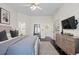 View of the main bedroom featuring contemporary decor, hardwood floors, ensuite bathroom at 9925 Keenan St, Highlands Ranch, CO 80130