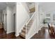 Staircase with carpet runner and hardwood floors at 9925 Keenan St, Highlands Ranch, CO 80130