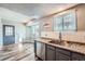 Kitchen with stainless steel sink, dishwasher and granite countertops at 4334 Liverpool Ct, Denver, CO 80249