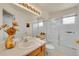 Bathroom featuring a bathtub with a shower, large mirror, and wooden vanity at 19075 E Grand Cir, Aurora, CO 80015