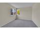 Neutral bedroom with carpet, two windows, and light colored walls at 19075 E Grand Cir, Aurora, CO 80015