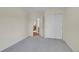 Bright bedroom featuring a closet with sliding doors and an ensuite bathroom at 19075 E Grand Cir, Aurora, CO 80015