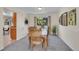 Formal dining room with a large window, wooden furniture, and neutral wall colors at 19075 E Grand Cir, Aurora, CO 80015