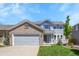 Attractive two-story home with a brick-accented garage and inviting curb appeal at 19075 E Grand Cir, Aurora, CO 80015