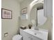 Cozy half bath features updated fixtures and stylish decor, perfect for guests at 19075 E Grand Cir, Aurora, CO 80015