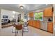 Inviting kitchen with ample cabinet space, stainless steel appliances, and a breakfast nook at 19075 E Grand Cir, Aurora, CO 80015