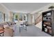 Bright living room featuring a large window, a staircase, and modern furnishings at 19075 E Grand Cir, Aurora, CO 80015