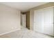 Bedroom featuring carpeted floors, closet with white sliding doors, and neutral-colored walls at 5546 Echo Hollow St, Castle Rock, CO 80104