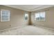 Bright bedroom with large windows and neutral carpet at 5546 Echo Hollow St, Castle Rock, CO 80104
