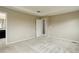 Large bedroom with neutral paint, carpet, and an ensuite bathroom at 5546 Echo Hollow St, Castle Rock, CO 80104