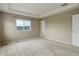 Spacious bedroom with a tray ceiling and large windows at 5546 Echo Hollow St, Castle Rock, CO 80104