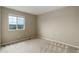 Neutral bedroom with a large window providing natural light and view of outdoors at 5546 Echo Hollow St, Castle Rock, CO 80104