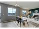 Dining room with modern decor, hardwood floors, and views of the backyard at 5546 Echo Hollow St, Castle Rock, CO 80104