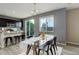 Modern kitchen flowing into a dining area with scenic views at 5546 Echo Hollow St, Castle Rock, CO 80104
