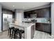 Modern kitchen featuring stainless steel appliances, granite countertops, and an island with seating at 5546 Echo Hollow St, Castle Rock, CO 80104