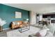 Open living room featuring a modern design, hardwood floors, and a dining area at 5546 Echo Hollow St, Castle Rock, CO 80104